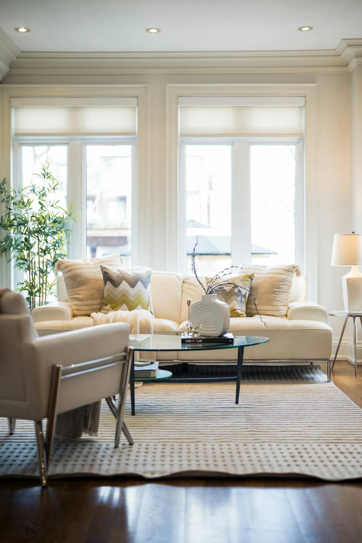 A bright living room with open floor space and comfortable seating